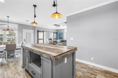 WATERFRONT LIVING | Fully Furnished | 2021 Palm Harbor Home
 on Mangrove Bay Golf Course in Florida - for sale on GolfHomes.com, golf home, golf lot