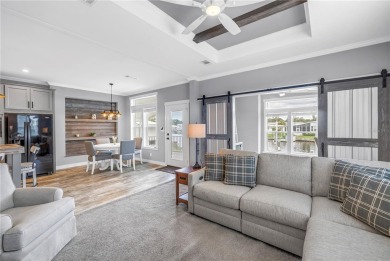 WATERFRONT LIVING | Fully Furnished | 2021 Palm Harbor Home
 on Mangrove Bay Golf Course in Florida - for sale on GolfHomes.com, golf home, golf lot