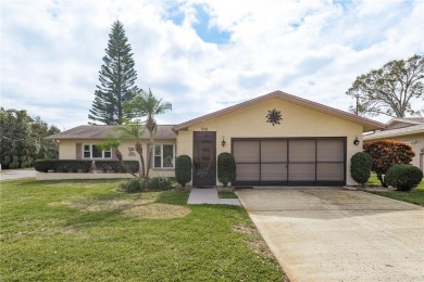 Located in the heart of Palm Harbor, 102 Stanford Drive is on Highland Lakes Executive Golf Course in Florida - for sale on GolfHomes.com, golf home, golf lot