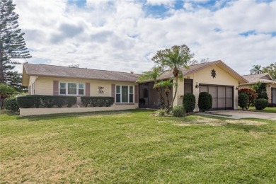 Located in the heart of Palm Harbor, 102 Stanford Drive is on Highland Lakes Executive Golf Course in Florida - for sale on GolfHomes.com, golf home, golf lot