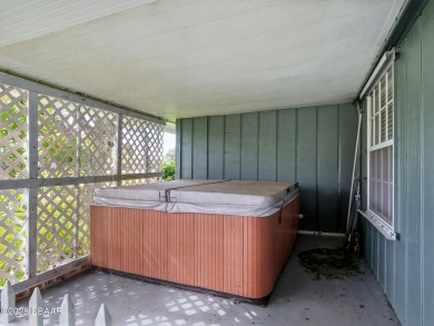 Tucked away in Fairgreen Estates on a manicured landscaped on New Smyrna Beach Golf Course in Florida - for sale on GolfHomes.com, golf home, golf lot