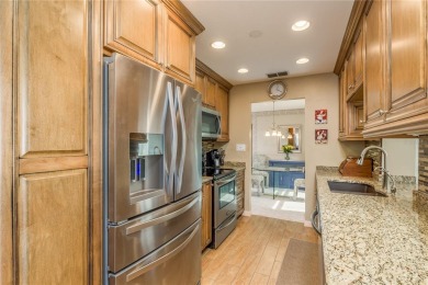 Located in the heart of Palm Harbor, 102 Stanford Drive is on Highland Lakes Executive Golf Course in Florida - for sale on GolfHomes.com, golf home, golf lot