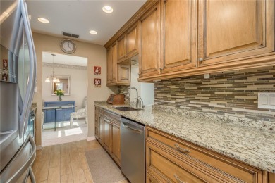 Located in the heart of Palm Harbor, 102 Stanford Drive is on Highland Lakes Executive Golf Course in Florida - for sale on GolfHomes.com, golf home, golf lot