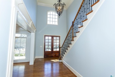 This custom home welcomes you with double front doors, an on Greystone Golf and Country Club-Founders Course in Alabama - for sale on GolfHomes.com, golf home, golf lot