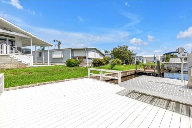 WATERFRONT LIVING | Fully Furnished | 2021 Palm Harbor Home
 on Mangrove Bay Golf Course in Florida - for sale on GolfHomes.com, golf home, golf lot