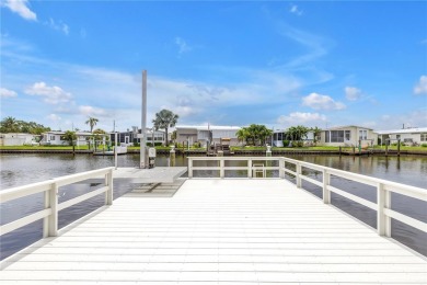 WATERFRONT LIVING | Fully Furnished | 2021 Palm Harbor Home
 on Mangrove Bay Golf Course in Florida - for sale on GolfHomes.com, golf home, golf lot