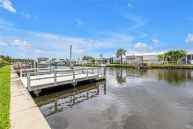 WATERFRONT LIVING | Fully Furnished | 2021 Palm Harbor Home
 on Mangrove Bay Golf Course in Florida - for sale on GolfHomes.com, golf home, golf lot