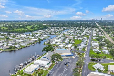 WATERFRONT LIVING | Fully Furnished | 2021 Palm Harbor Home
 on Mangrove Bay Golf Course in Florida - for sale on GolfHomes.com, golf home, golf lot
