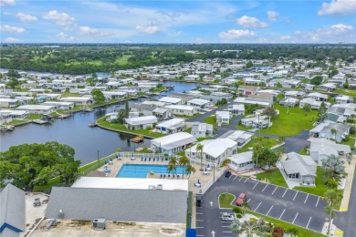 WATERFRONT LIVING | Fully Furnished | 2021 Palm Harbor Home
 on Mangrove Bay Golf Course in Florida - for sale on GolfHomes.com, golf home, golf lot