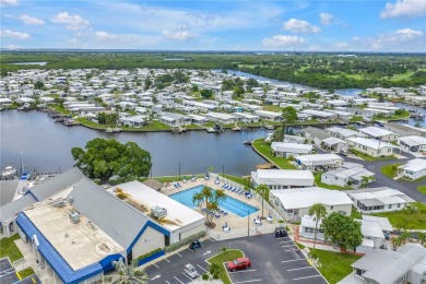 WATERFRONT LIVING | Fully Furnished | 2021 Palm Harbor Home
 on Mangrove Bay Golf Course in Florida - for sale on GolfHomes.com, golf home, golf lot