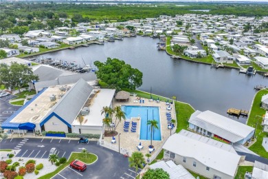 WATERFRONT LIVING | Fully Furnished | 2021 Palm Harbor Home
 on Mangrove Bay Golf Course in Florida - for sale on GolfHomes.com, golf home, golf lot