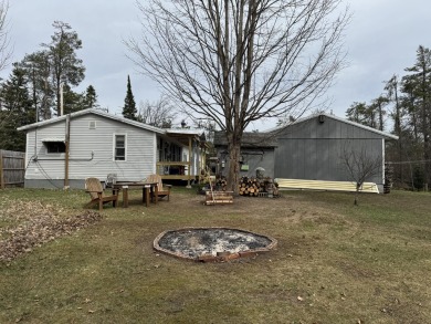 If you are looking for a cozy home or up north retreat look no on Garland Resort and Golf Club  in Michigan - for sale on GolfHomes.com, golf home, golf lot