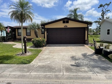 Immaculate two bedroom, two bath home with a two-car garage in on Del Tura Golf and Country Club in Florida - for sale on GolfHomes.com, golf home, golf lot