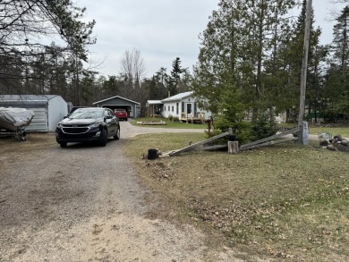 If you are looking for a cozy home or up north retreat look no on Garland Resort and Golf Club  in Michigan - for sale on GolfHomes.com, golf home, golf lot