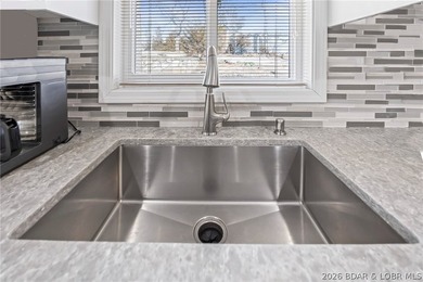 Newer metal roof, gutters & downspouts, newer vinyl siding on Indian Rock Golf Club in Missouri - for sale on GolfHomes.com, golf home, golf lot