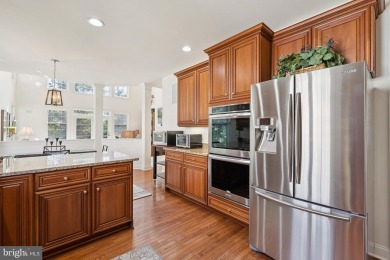 Nestled in a serene cul-de-sac in the sought-after gated on Dominion Valley Country Club in Virginia - for sale on GolfHomes.com, golf home, golf lot