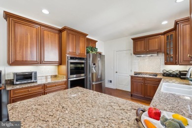 Nestled in a serene cul-de-sac in the sought-after gated on Dominion Valley Country Club in Virginia - for sale on GolfHomes.com, golf home, golf lot