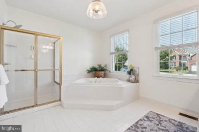 Nestled in a serene cul-de-sac in the sought-after gated on Dominion Valley Country Club in Virginia - for sale on GolfHomes.com, golf home, golf lot
