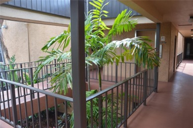 Experience serenity in this stunning 1-bedroom, 1-bathroom on Jacaranda Golf Club in Florida - for sale on GolfHomes.com, golf home, golf lot