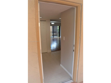 Experience serenity in this stunning 1-bedroom, 1-bathroom on Jacaranda Golf Club in Florida - for sale on GolfHomes.com, golf home, golf lot