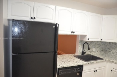 Experience serenity in this stunning 1-bedroom, 1-bathroom on Jacaranda Golf Club in Florida - for sale on GolfHomes.com, golf home, golf lot