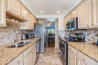 Welcome to this exclusive deluxe two bedroom, two bath corner on Cove Cay Country Club in Florida - for sale on GolfHomes.com, golf home, golf lot