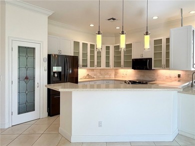 Sunny Oak Harbor Home on 4th fairway w/ an elevated terrace on Oak Harbor Country Club in Florida - for sale on GolfHomes.com, golf home, golf lot