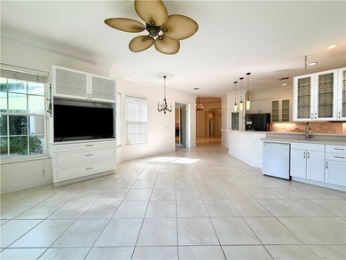 Sunny Oak Harbor Home on 4th fairway w/ an elevated terrace on Oak Harbor Country Club in Florida - for sale on GolfHomes.com, golf home, golf lot