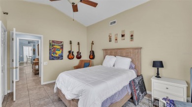 Enjoy peaceful golf course and water views from this 2-bedroom on Imperial Lakes Country Club in Florida - for sale on GolfHomes.com, golf home, golf lot
