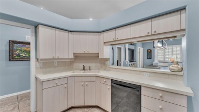 Enjoy peaceful golf course and water views from this 2-bedroom on Imperial Lakes Country Club in Florida - for sale on GolfHomes.com, golf home, golf lot