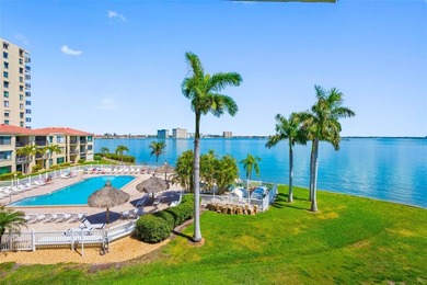 Premium WATERFRONT CORNER CONDO WITH PANORAMIC WATER VIEWS ON on Isla Del Sol Yacht and Country Club in Florida - for sale on GolfHomes.com, golf home, golf lot