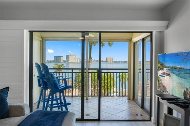 Premium WATERFRONT CORNER CONDO WITH PANORAMIC WATER VIEWS ON on Isla Del Sol Yacht and Country Club in Florida - for sale on GolfHomes.com, golf home, golf lot
