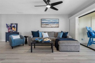 Premium WATERFRONT CORNER CONDO WITH PANORAMIC WATER VIEWS ON on Isla Del Sol Yacht and Country Club in Florida - for sale on GolfHomes.com, golf home, golf lot