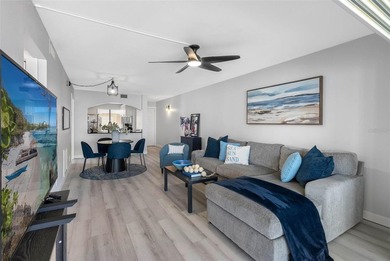 Premium WATERFRONT CORNER CONDO WITH PANORAMIC WATER VIEWS ON on Isla Del Sol Yacht and Country Club in Florida - for sale on GolfHomes.com, golf home, golf lot