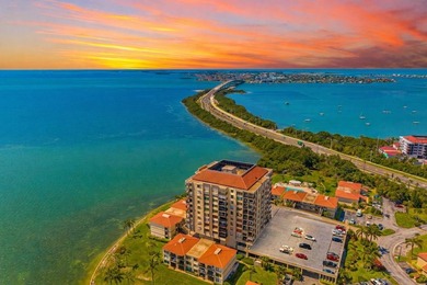 Premium WATERFRONT CORNER CONDO WITH PANORAMIC WATER VIEWS ON on Isla Del Sol Yacht and Country Club in Florida - for sale on GolfHomes.com, golf home, golf lot