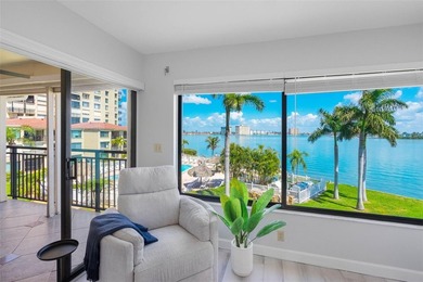Premium WATERFRONT CORNER CONDO WITH PANORAMIC WATER VIEWS ON on Isla Del Sol Yacht and Country Club in Florida - for sale on GolfHomes.com, golf home, golf lot