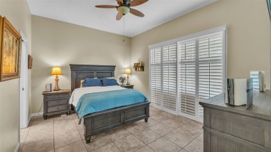 Enjoy peaceful golf course and water views from this 2-bedroom on Imperial Lakes Country Club in Florida - for sale on GolfHomes.com, golf home, golf lot