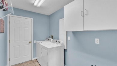 Enjoy peaceful golf course and water views from this 2-bedroom on Imperial Lakes Country Club in Florida - for sale on GolfHomes.com, golf home, golf lot