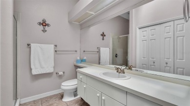 Enjoy peaceful golf course and water views from this 2-bedroom on Imperial Lakes Country Club in Florida - for sale on GolfHomes.com, golf home, golf lot