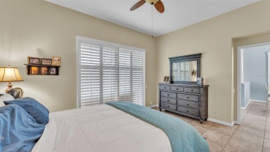 Enjoy peaceful golf course and water views from this 2-bedroom on Imperial Lakes Country Club in Florida - for sale on GolfHomes.com, golf home, golf lot