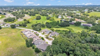 Enjoy peaceful golf course and water views from this 2-bedroom on Imperial Lakes Country Club in Florida - for sale on GolfHomes.com, golf home, golf lot