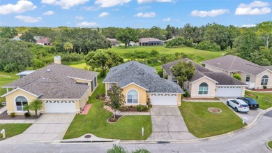 Enjoy peaceful golf course and water views from this 2-bedroom on Imperial Lakes Country Club in Florida - for sale on GolfHomes.com, golf home, golf lot
