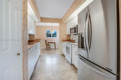 Ground floor corner Magnolia unit, with garden views, and on Flamingo Lakes Country Club in Florida - for sale on GolfHomes.com, golf home, golf lot