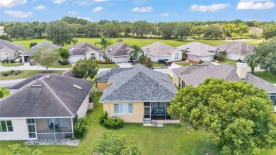 Enjoy peaceful golf course and water views from this 2-bedroom on Imperial Lakes Country Club in Florida - for sale on GolfHomes.com, golf home, golf lot