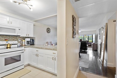 Welcome to this stunning 2-bed 2-bath condo located on the first on Boca Dunes Golf and Country Club in Florida - for sale on GolfHomes.com, golf home, golf lot