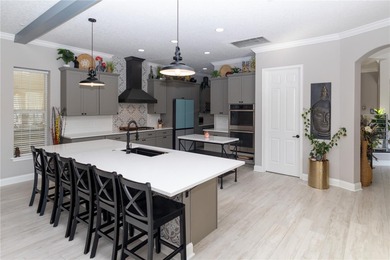 Fall in love with this stunning custom pool home featuring a on Harmony Golf Preserve in Florida - for sale on GolfHomes.com, golf home, golf lot