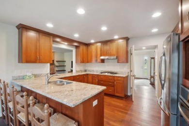 Timeless Richard Adams Russell design in prestigious Travis on Travis Pointe Country Club in Michigan - for sale on GolfHomes.com, golf home, golf lot