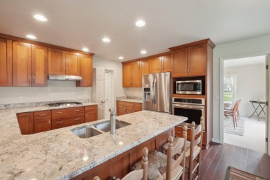 Timeless Richard Adams Russell design in prestigious Travis on Travis Pointe Country Club in Michigan - for sale on GolfHomes.com, golf home, golf lot