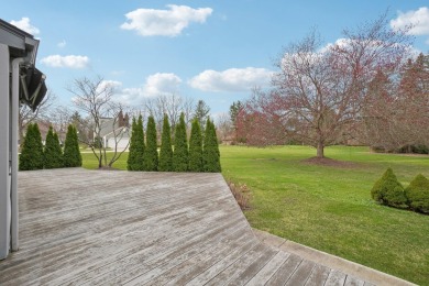Timeless Richard Adams Russell design in prestigious Travis on Travis Pointe Country Club in Michigan - for sale on GolfHomes.com, golf home, golf lot