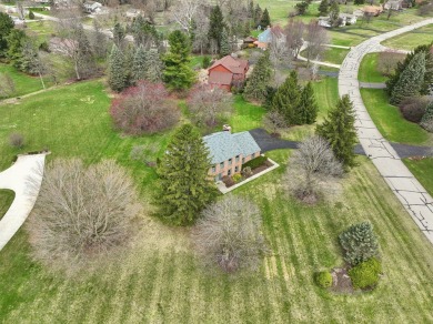 Timeless Richard Adams Russell design in prestigious Travis on Travis Pointe Country Club in Michigan - for sale on GolfHomes.com, golf home, golf lot